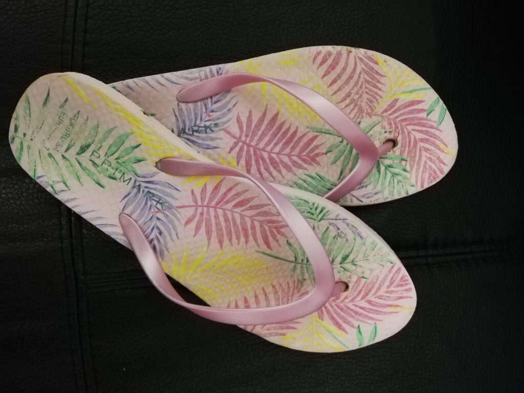 Pink patterned flip flops
