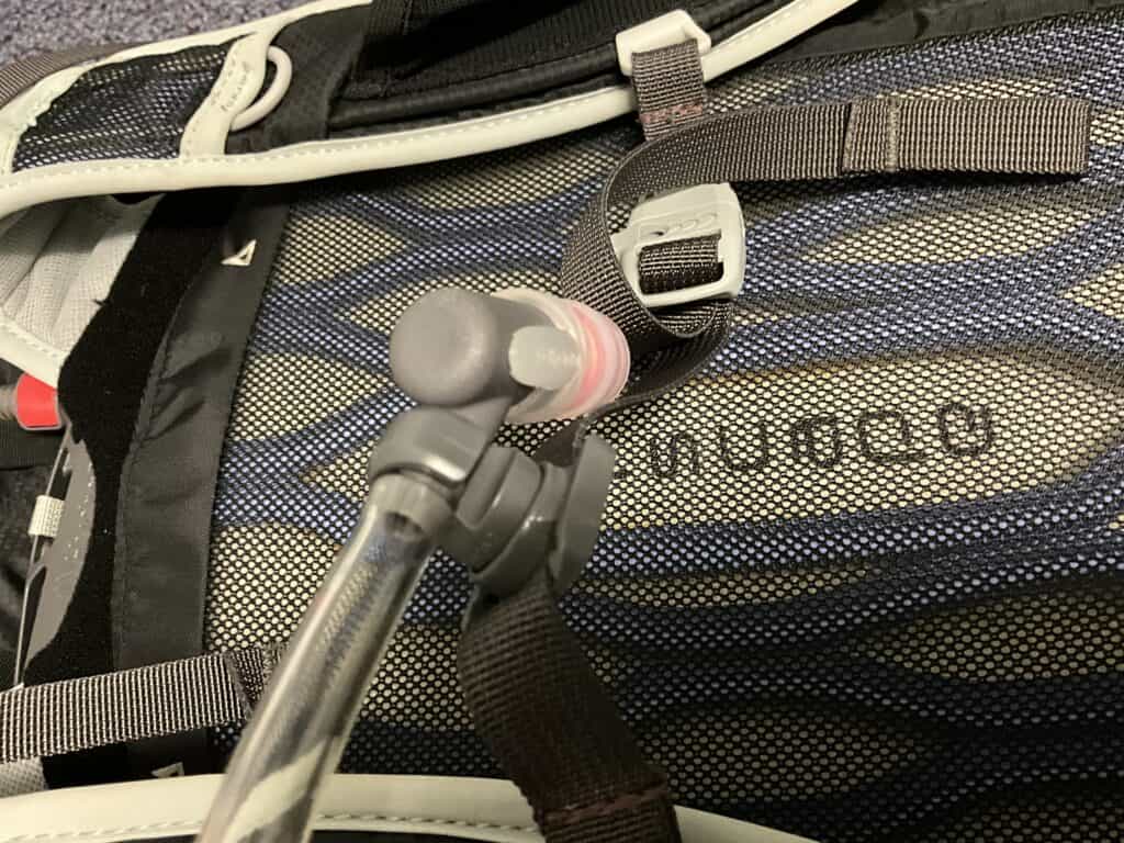 Bite valve attached to the magnet on the chest strap to hold it in place