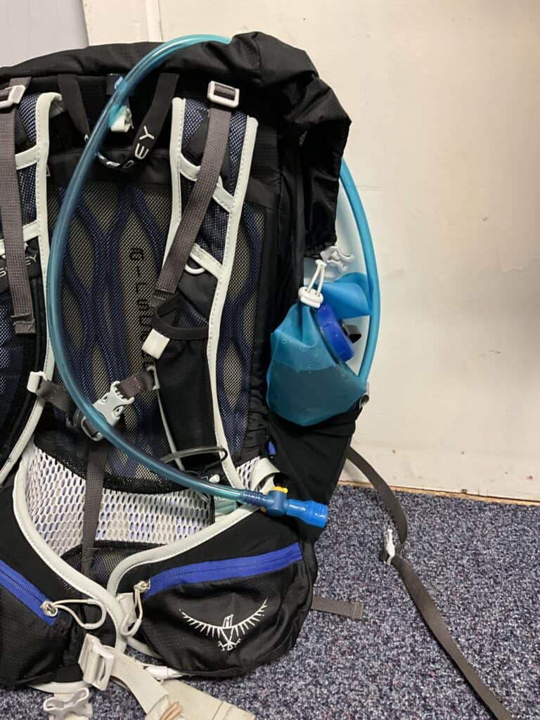 Hydration bladder in side pouch.