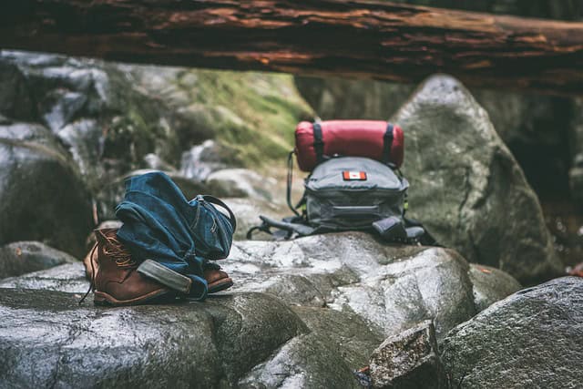 Clothing and backpack on rocks